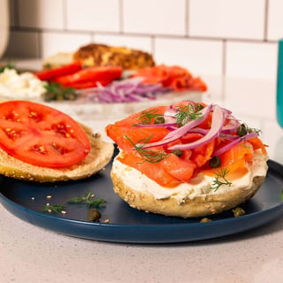 NOVA LOX, CREAM CHEESE, ONIONS & TOMATOES